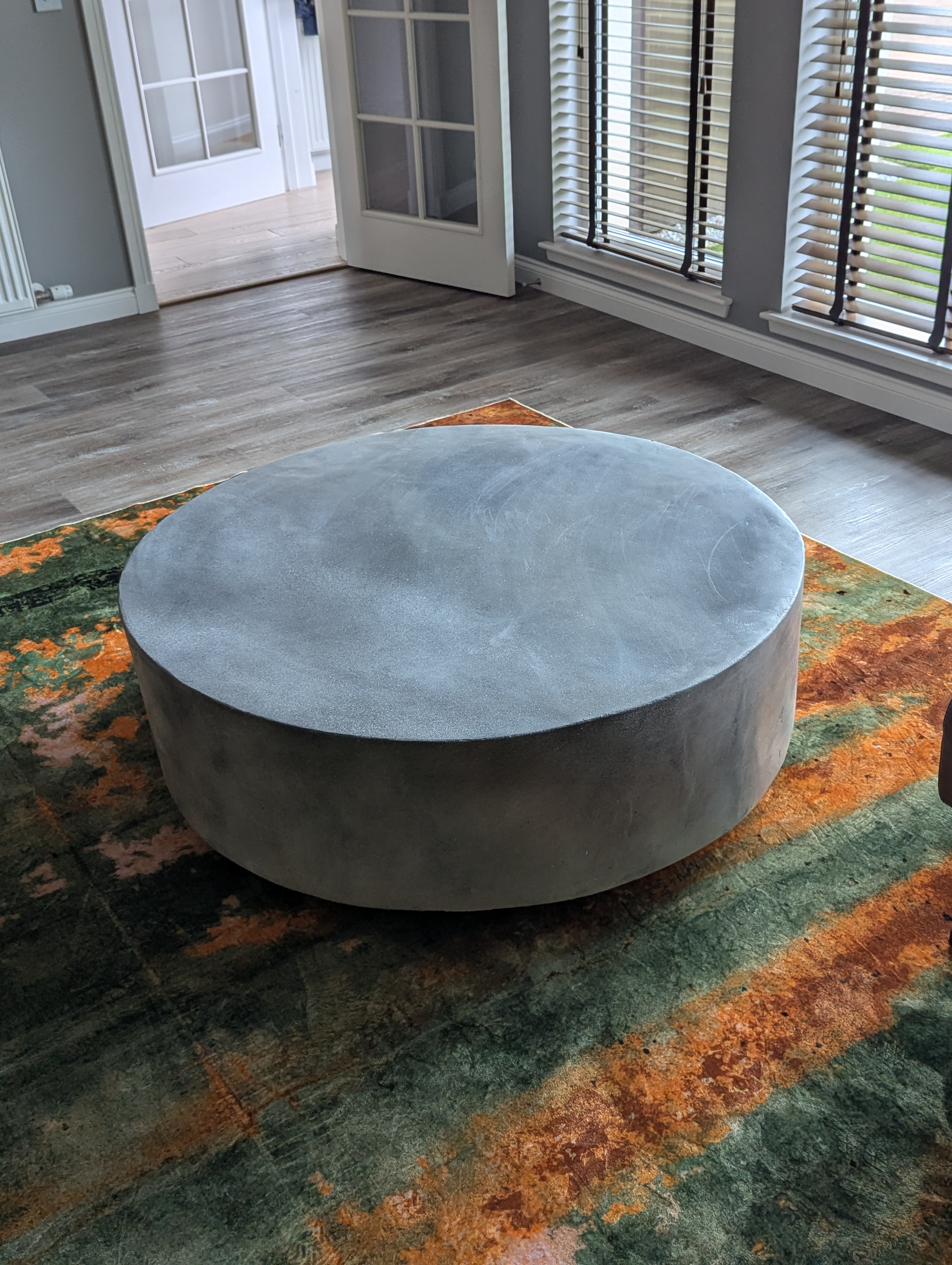 Round Drum Concrete Coffee Table on colourful rug — Concreet UK